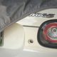 My mom keeps a cover on her Miata, but it’s mainly to keep the cats from scratching it when they run into the garage. Photo credit: Alanis King
